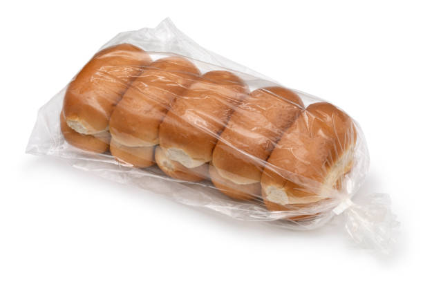 Plastic bag with traditional Dutch white soft buns on white background