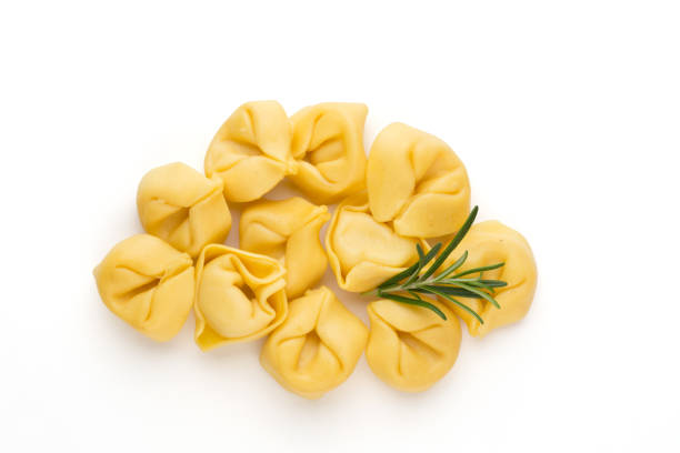 istock Raw homemade pasta,tortellini with herbs. 1385176495