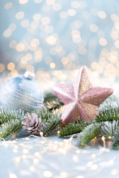 istock Christmas spruce with star and blurred shiny lights. 1385176522