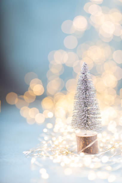 istock Christmas spruce with tree and blurred shiny lights. 1385176548
