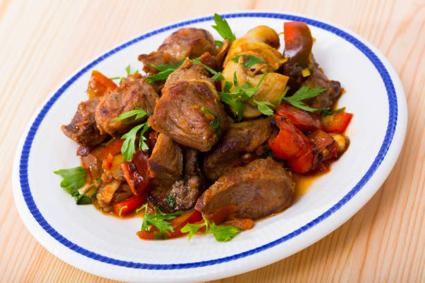 istock Meat baked with mushrooms and vegetables 1385181348