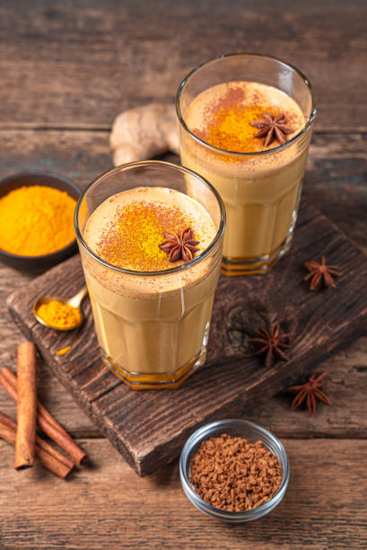 istock Cappuccino with turmeric, anise and cinnamon on a wooden background 1385188312