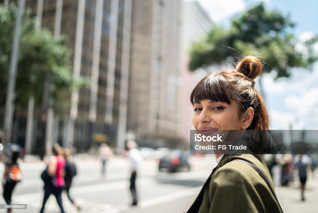 Portrait of a young woman in the street One Woman Only Stock Photo