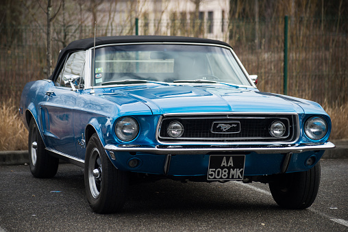 Mulhouse - France - 13 March 2022 - Front view of blue ford mustang 1967 parked in the street