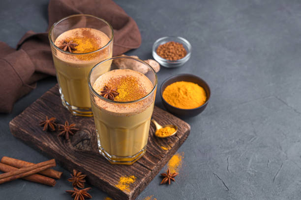 istock A healthy immune-supporting drink with milk, turmeric, coffee and cinnamon on a dark background 1385190432