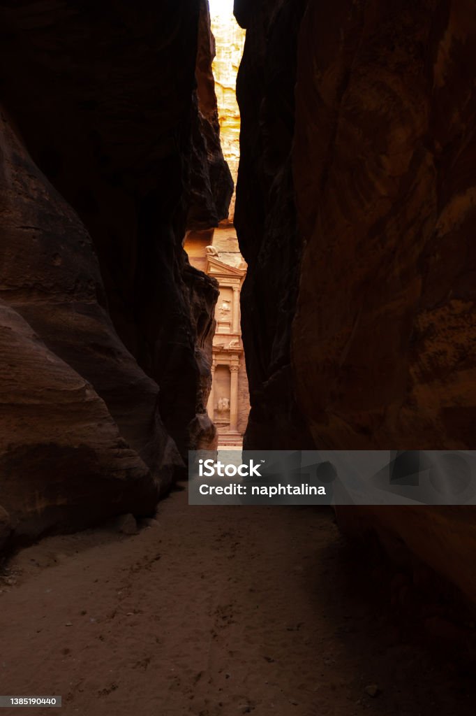 Al-Khazneh ("The Treasury"‎‎) is one of the most elaborate temples in the ancient Arab Nabatean Kingdom city of Petra. This structure was carved out of a sandstone rock face. Facade seen from the canyon. Adventure Stock Photo