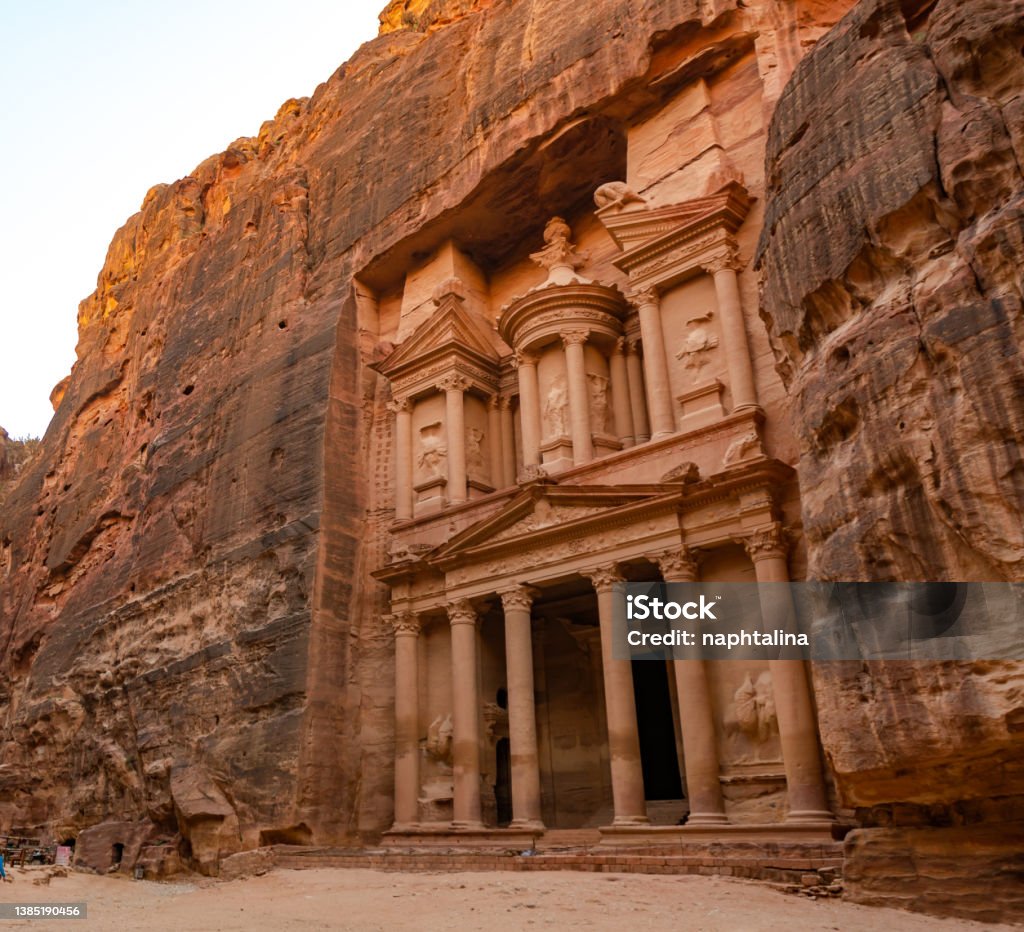 Al-Khazneh ("The Treasury"‎‎) is one of the most elaborate temples in the ancient Arab Nabatean Kingdom city of Petra. This structure was carved out of a sandstone rock face. Adventure Stock Photo