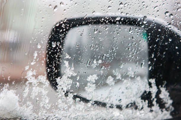 istock wet snow on the car window in winter 1385190558