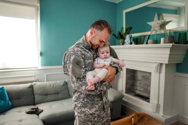 istock Father is happy with his daughter after a long overseas military assignment 1385190947