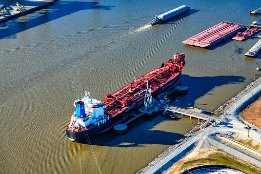 Large oil tanker moored along the banks of the  Mobile River in Mobile Alabama shot from an altitude of about 500 feet.