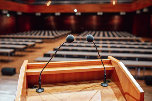 Germany: Microphones on a lectern in a conference rooms.