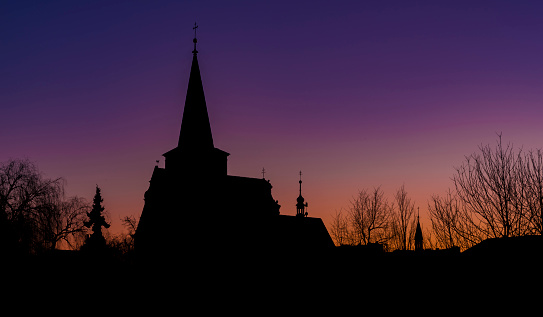 Church in LItovel town with sunrise colors on sky in winter morning
