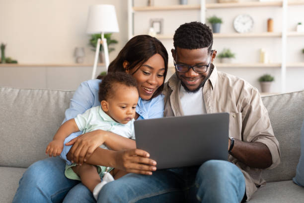 istock Portrait of black family using tablet at home 1385197874