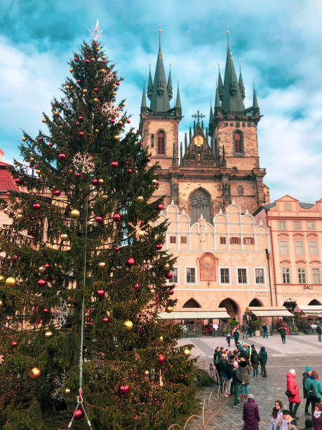 Prague old town square in Christmas time. People on vacation in Prague during Christmas Prague, Czechia - December 27, 2021: People sightseeing in Prague. Historical landmarks of city prague christmas market stock pictures, royalty-free photos & images