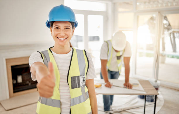 istock Shot of an attractive young construction worker standing inside and making a thumbs up gesture 1385202030