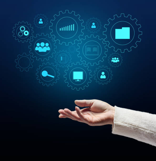 istock Control and management of business processes in the enterprise for efficient operation and increased profits. Concept with manager's hand and gears on holographic screen 1385204000
