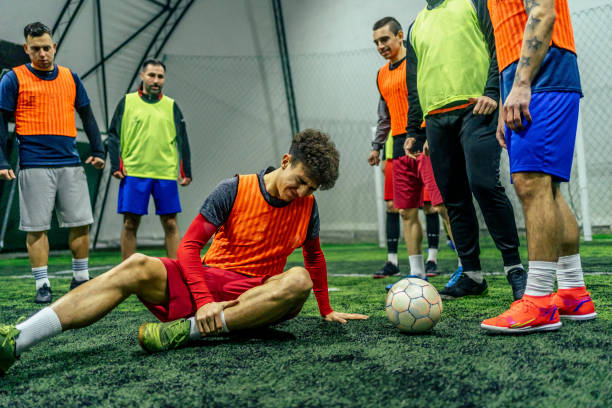 istock Soccer player holding his injured leg 1385204003