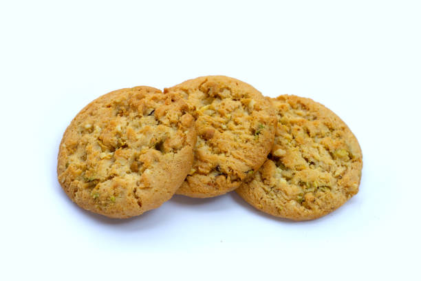 istock pistachio and almond cookies on white background. 1385205091
