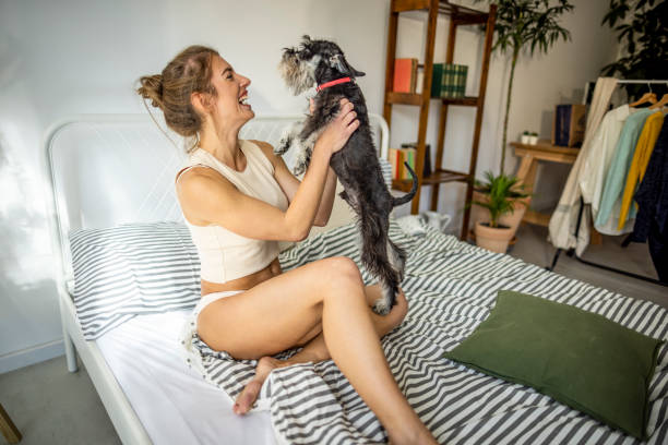istock Woman and her dog morning routine 1385205585
