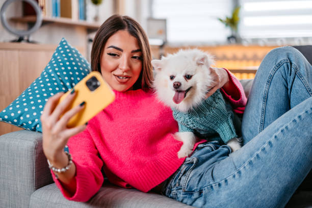 istock Young Woman Taking A Selfie With Her Dog 1385207527