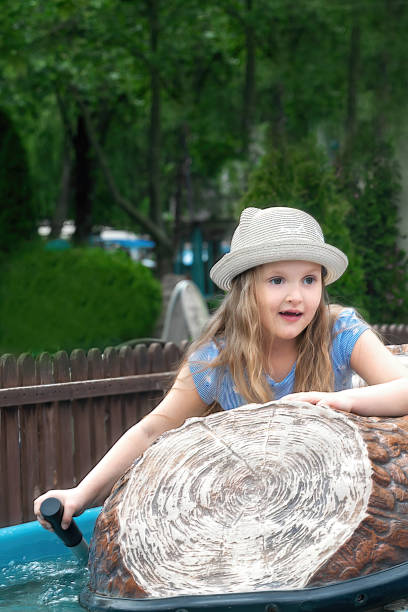 istock preschool girl in amusement park 1385207529