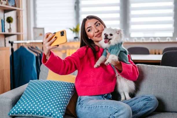istock Young Woman Taking A Selfie With Her Dog 1385208093