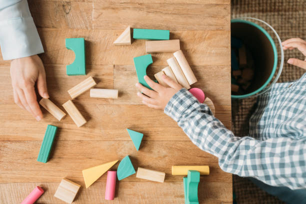 istock Family playing with building blocks 1385209626