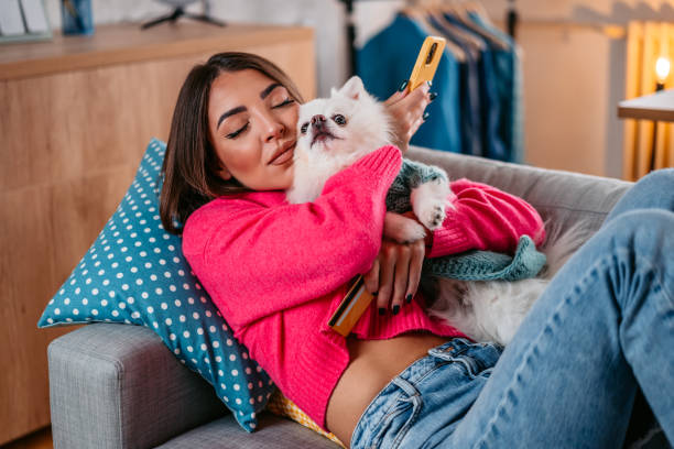 istock Young Woman Cuddling With Her Dog 1385209638