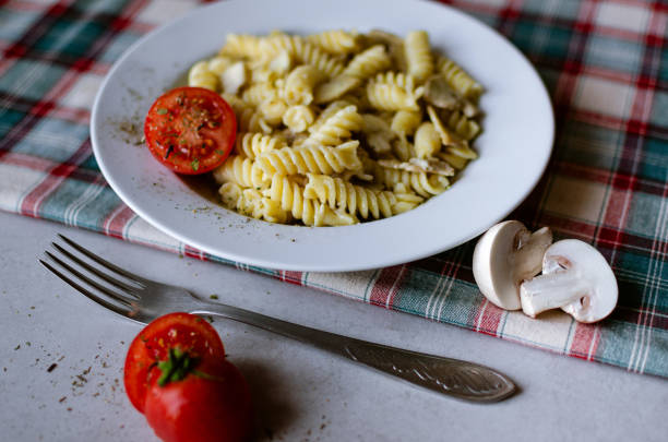 Italian pasta with mushrooms. Cooked at home, in a home atmosphere.