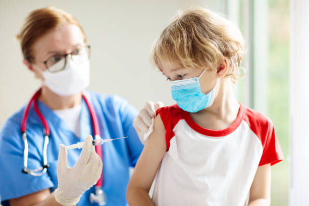 istock Child covid-19 vaccine. Coronavirus vaccination. 1385209698