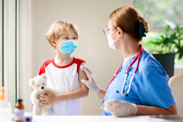istock Child covid-19 vaccine. Coronavirus vaccination. 1385209725