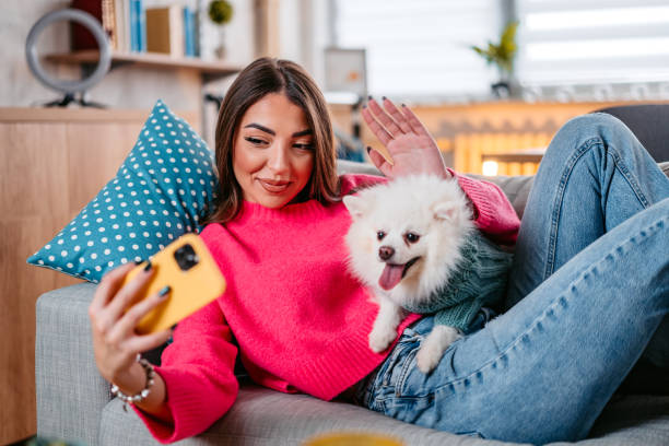 istock Young Woman Taking A Selfie With Her Dog 1385209839