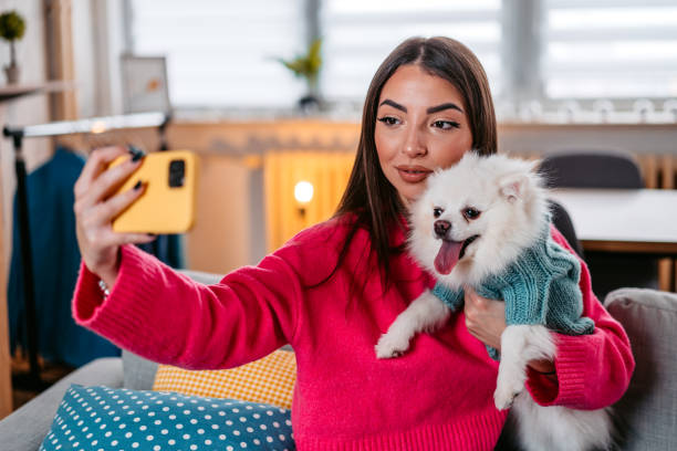 istock Young Woman Taking A Selfie With Her Dog 1385209895