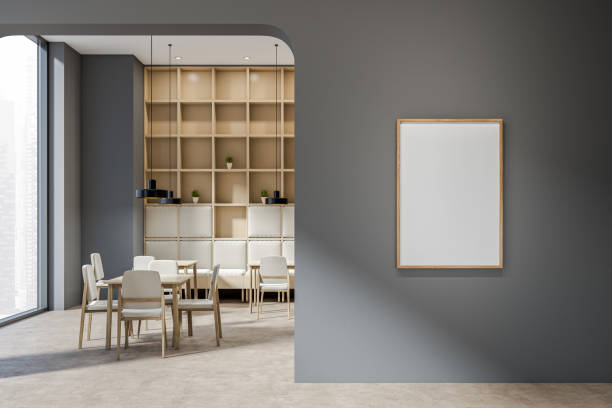 istock Dark cafe interior with empty white poster, tables with chairs 1385210122