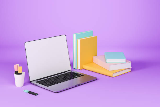 istock Laptop and pile of books with tools, education and learning. Mock up screen 1385210976