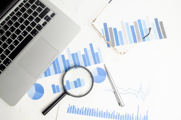 istock Office desktop. Calculator, Glasses, Magnifier, Notepad, Pen, Coffee Cup. On a white background. Top view. Free space for text. 1385211079