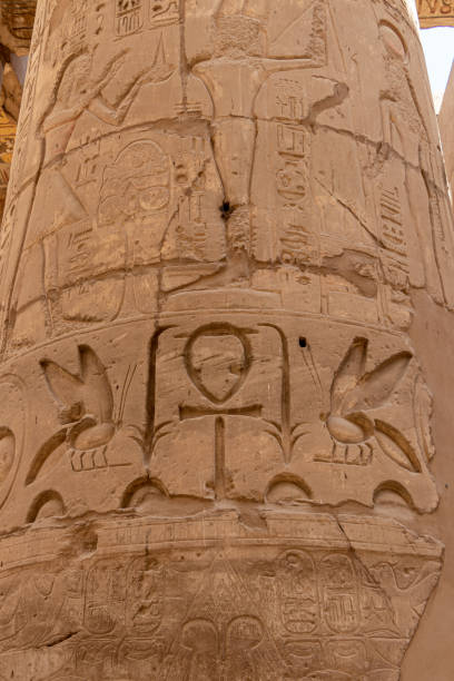 istock Massive columns inside a beautiful Egyptian temple in Luxor with hieroglyphics. 1385211546
