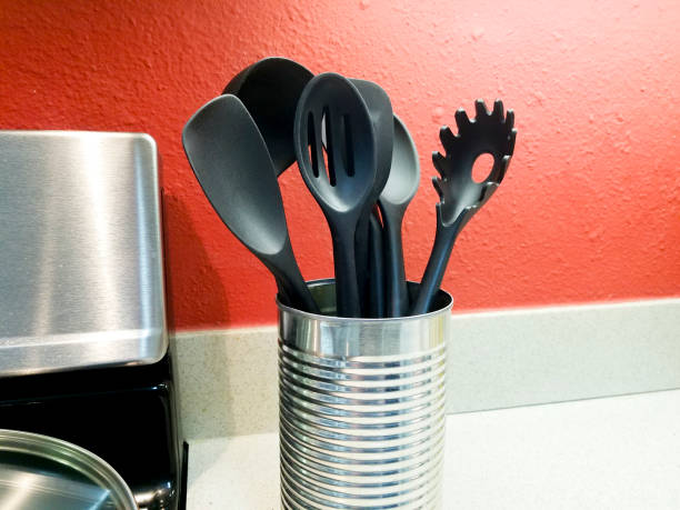 istock Cooking utensils sitting on counter in a domestic kitchen. 1385214430
