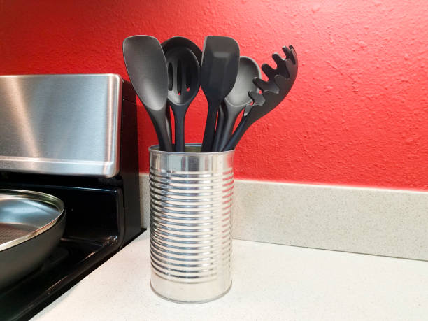 istock Cooking utensils sitting on counter in a domestic kitchen. 1385214448