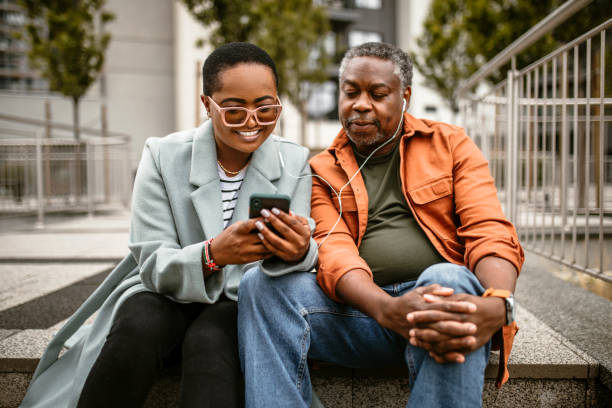 istock Senior father and daughter taking a rest from city walk 1385216290