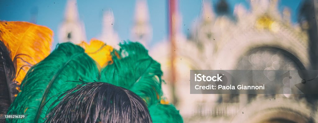 Colorful hat feathers with Venice colors in St Mark Square for Mardi Gras parade, Italy. Colorful hat feathers with Venice colors in St Mark Square for Mardi Gras parade, Italy Abstract Stock Photo