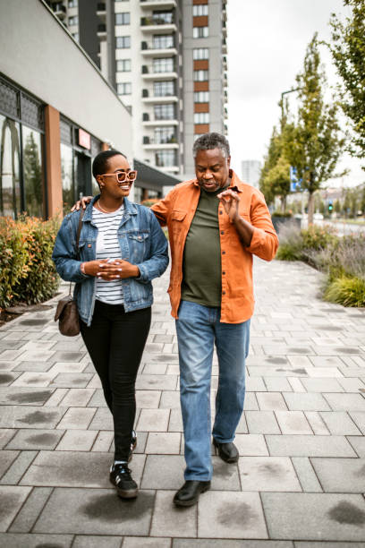 istock Daughter spending time with her senior father, enjoying sunny day 1385216846