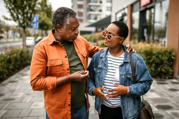 istock Daughter spending time with her senior father, enjoying sunny day 1385216877