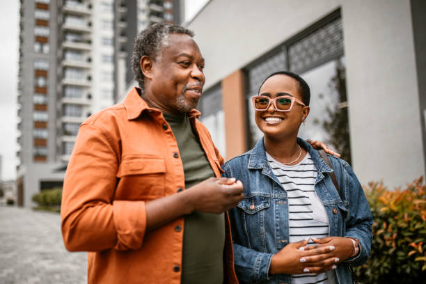 istock Daughter spending time with her senior father, enjoying sunny day 1385216947