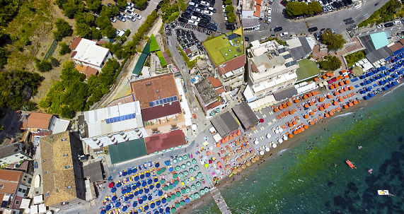 Overhead aerial view of Marina del Cantone Beach on a sunny day, Amalfi Coast - Italy