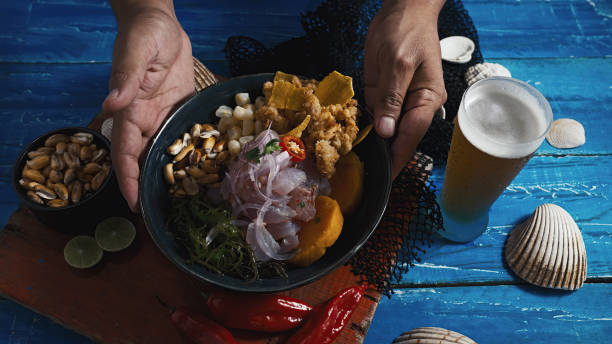 Peruvian ceviche and squid chicharron stock photo