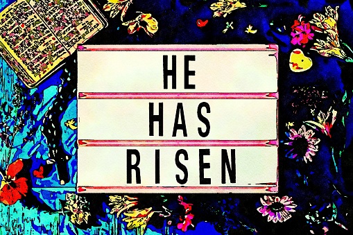 The Words 'He Has Risen' in Lightbox Trend surrounded by an abundance of beautiful flowers, a bible and a religious cross.