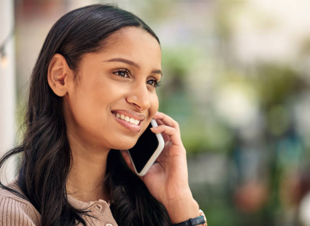 istock Shot of a young florist using her smartphone to make a call 1385229749