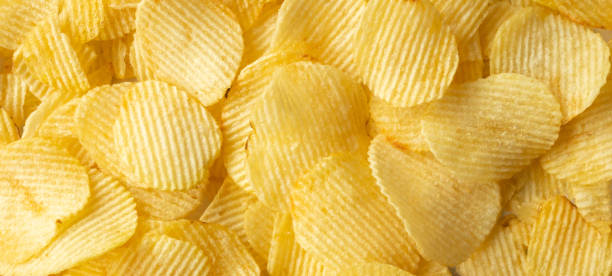 istock crispy golden potato chips snack texture background 1385234935