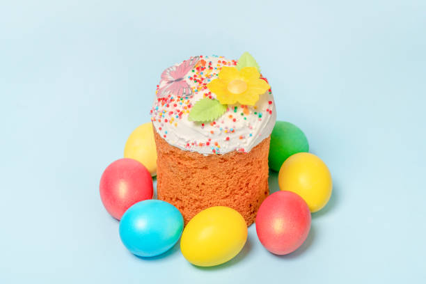 istock Easter cake and colorful eggs on blue. Easter day. 1385235188
